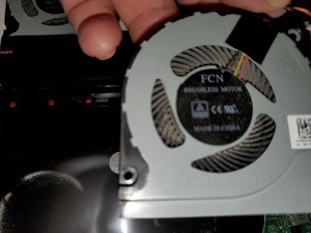 cooling fan filled with dust on laptop