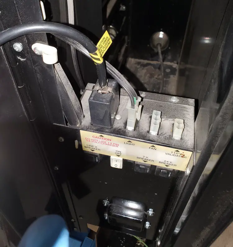 location of power supply and coin mech attachment inside vending machine